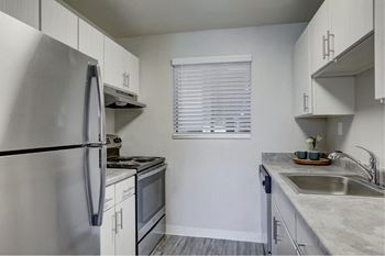 Hudson at highline apartments in denver, colorado kitchen with stainless steel appliances